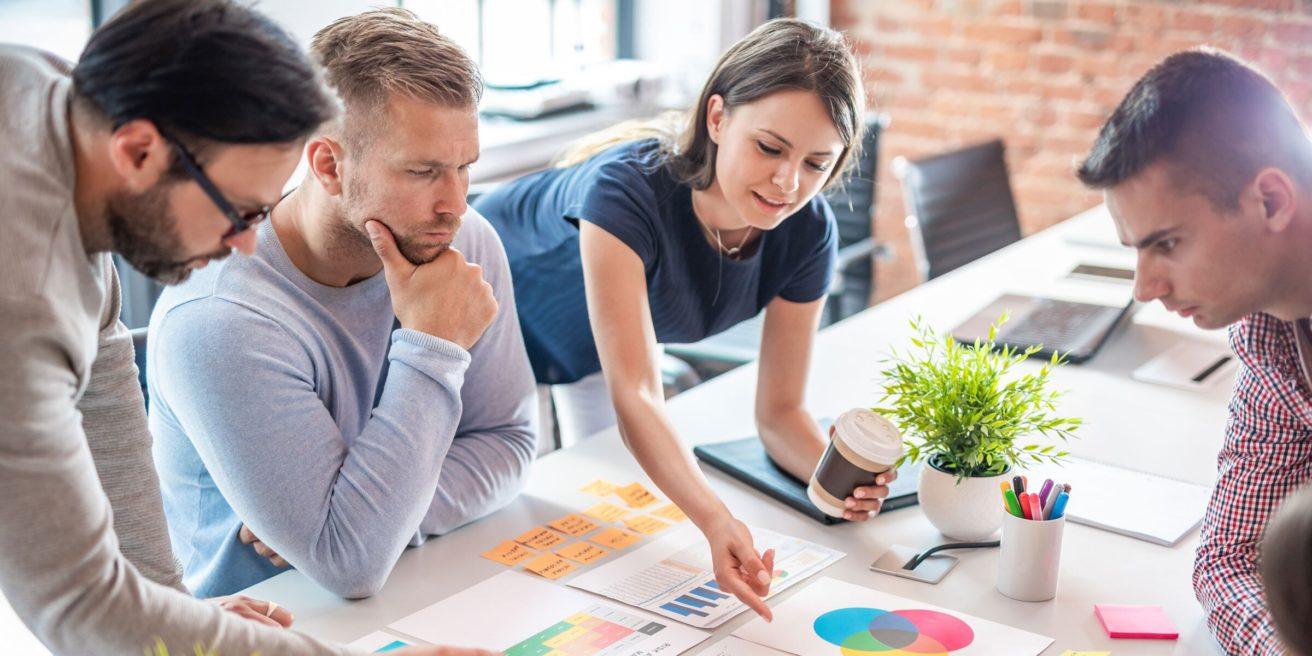 two people working with sticky notes